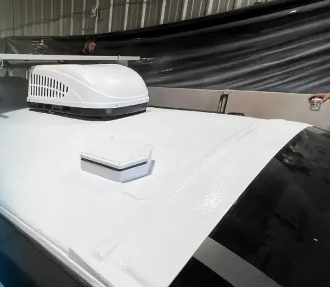 Seamless sprayed membrane around an RV air conditioner